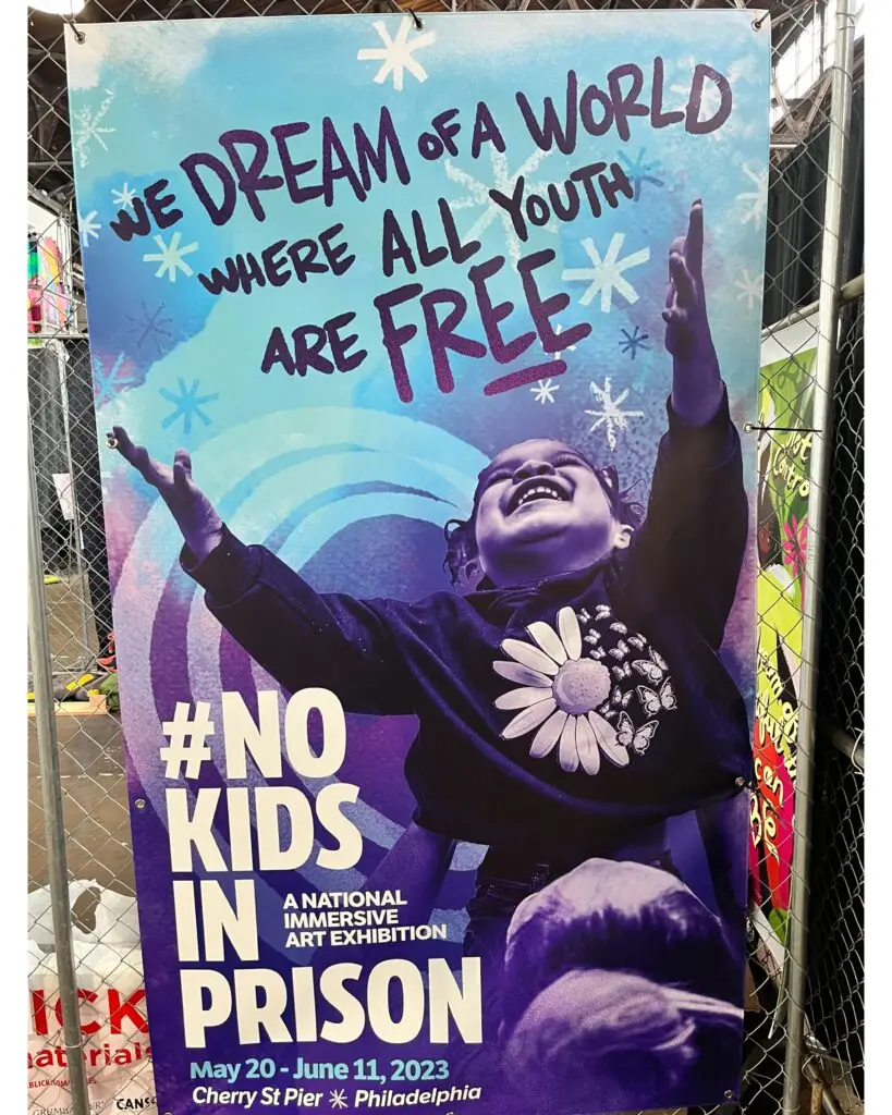 Poster reading "We dream of a world where all youth are free" from the #NoKidsInPrison art exhibition