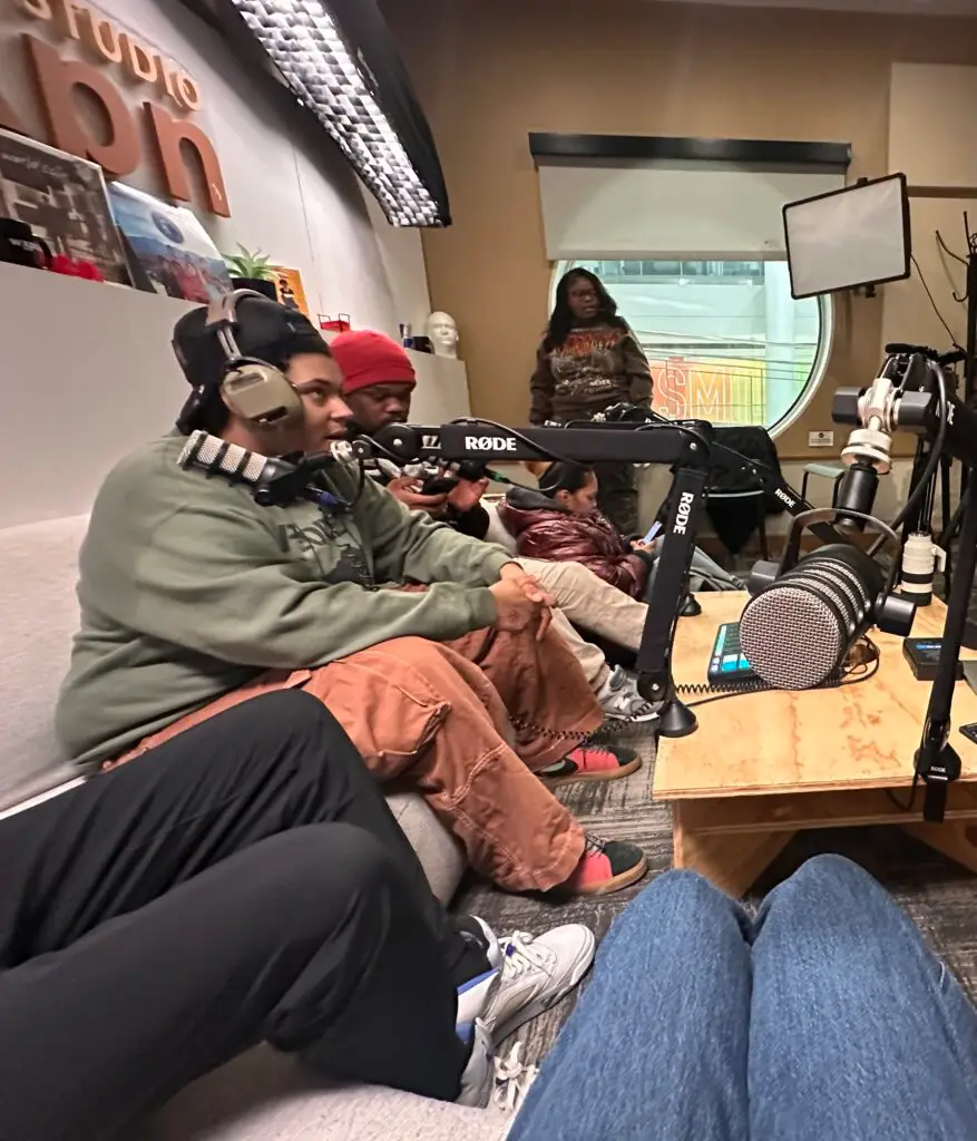Young people recording a podcast episode in a studio